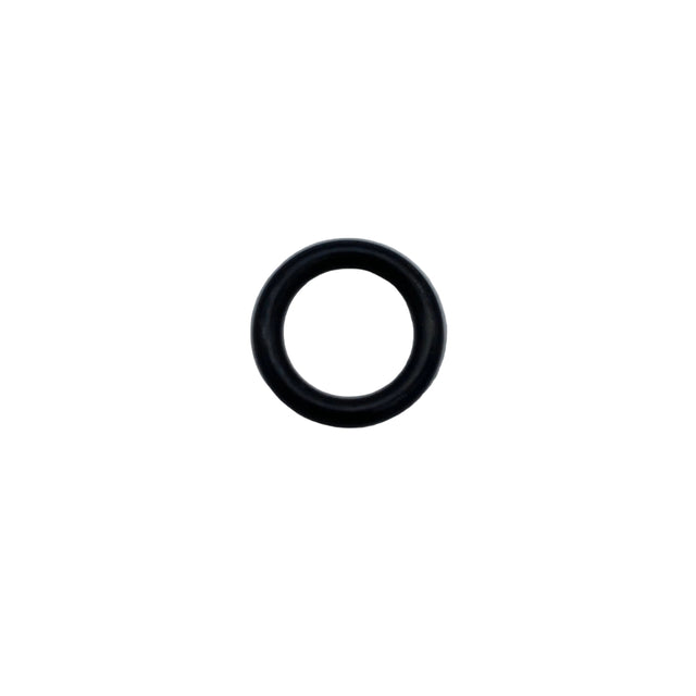 A small black rubber O-ring centered on a light gray, scratched surface. 670B2011 - O RING - KAWASAKI ENGINE PARTS
