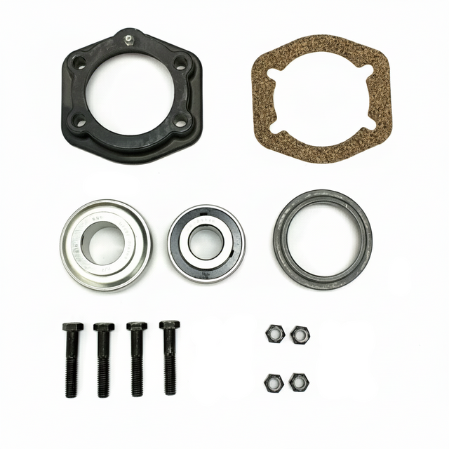 A mechanical parts kit laid out on a white background, including a black circular flange, a brown gasket, two silver ball bearings, two black washers, two black screws, and several small black fasteners and rings. BK-210HDB-AM - HD 1.25" BEARING & FLANGE KIT - MIDDLE (2010-2017) - AFTERMARKET
