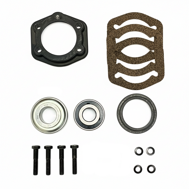 A mechanical parts kit laid out on a white background, including a black circular gasket, a brown textured pad, two metal bearings, washers, and nuts. BK-211HDB-AM - HD 1.25" BEARING & FLANGE KIT - FRONT/REAR (2010-2017) - AFTERMARKET