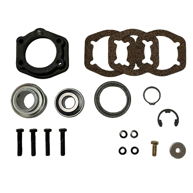 A mechanical parts kit laid out on a white background, including a black circular ring, four brown textured gaskets, two metal bearings, several black washers and clips, plus screws and a small brass-toned bolt. BK-311HDB-AM - HD 1.375" BEARING & FLANGE KIT - FRONT/REAR (2017+) - AFTERMARKET