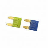 Two small fuse-like components on a light gray surface, one bright yellow and one blue, each with exposed metal terminals. 593901 - FUSE - BRIGGS &amp; STRATTON PARTS
