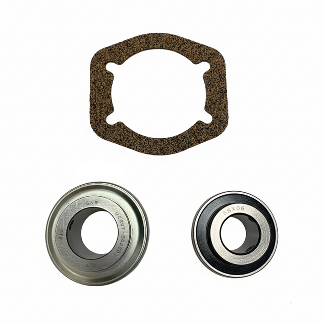 A mechanical bearing kit on a white background, including a brown textured gasket, a silver metal bearing, a black and silver bearing. BK-200HDB-AM - HD 1.25" BEARING KIT - MIDDLE (2010-2017) - AFTERMARKET