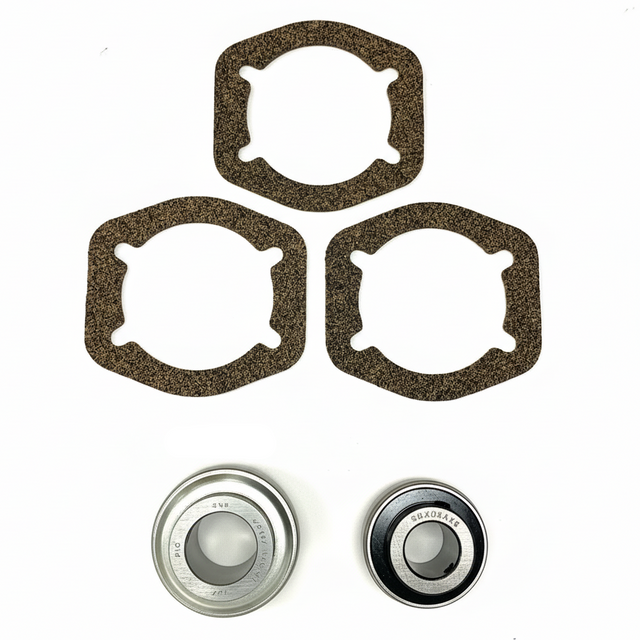 A set of mechanical parts on a white background, including three dark brown textured gaskets, two metal bearings. BK-201HDB-AM - HD 1.25" BEARING KIT - FRONT/REAR (2010-2017) - AFTERMARKET