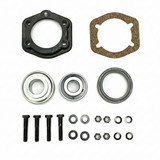 A mechanical parts kit laid out on a white background, including a black circular flange, a brown gasket, two silver ball bearings, two black washers, two black screws, and several small black fasteners and rings. BK-210HDB-AM - HD 1.25" BEARING & FLANGE KIT - MIDDLE (2010-2017) - AFTERMARKET