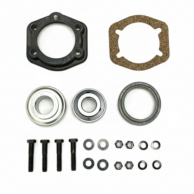 A mechanical parts kit laid out on a white background, including a black circular flange, a brown gasket, two silver ball bearings, two black washers, two black screws, and several small black fasteners and rings. BK-210HDB-AM - HD 1.25" BEARING & FLANGE KIT - MIDDLE (2010-2017) - AFTERMARKET